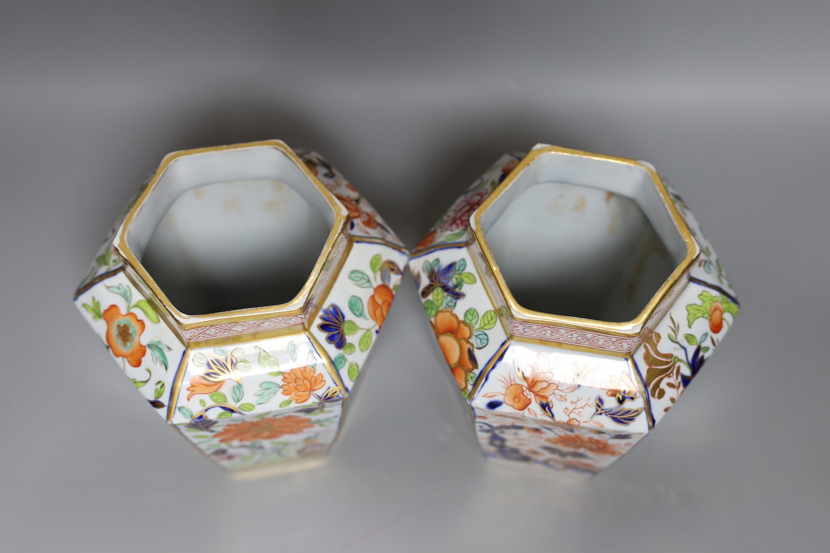 A pair of early 19th century Masons hexagonal ironstone jars and covers 24cm, impressed mark ‘Patent Ironstone China’ to covers only